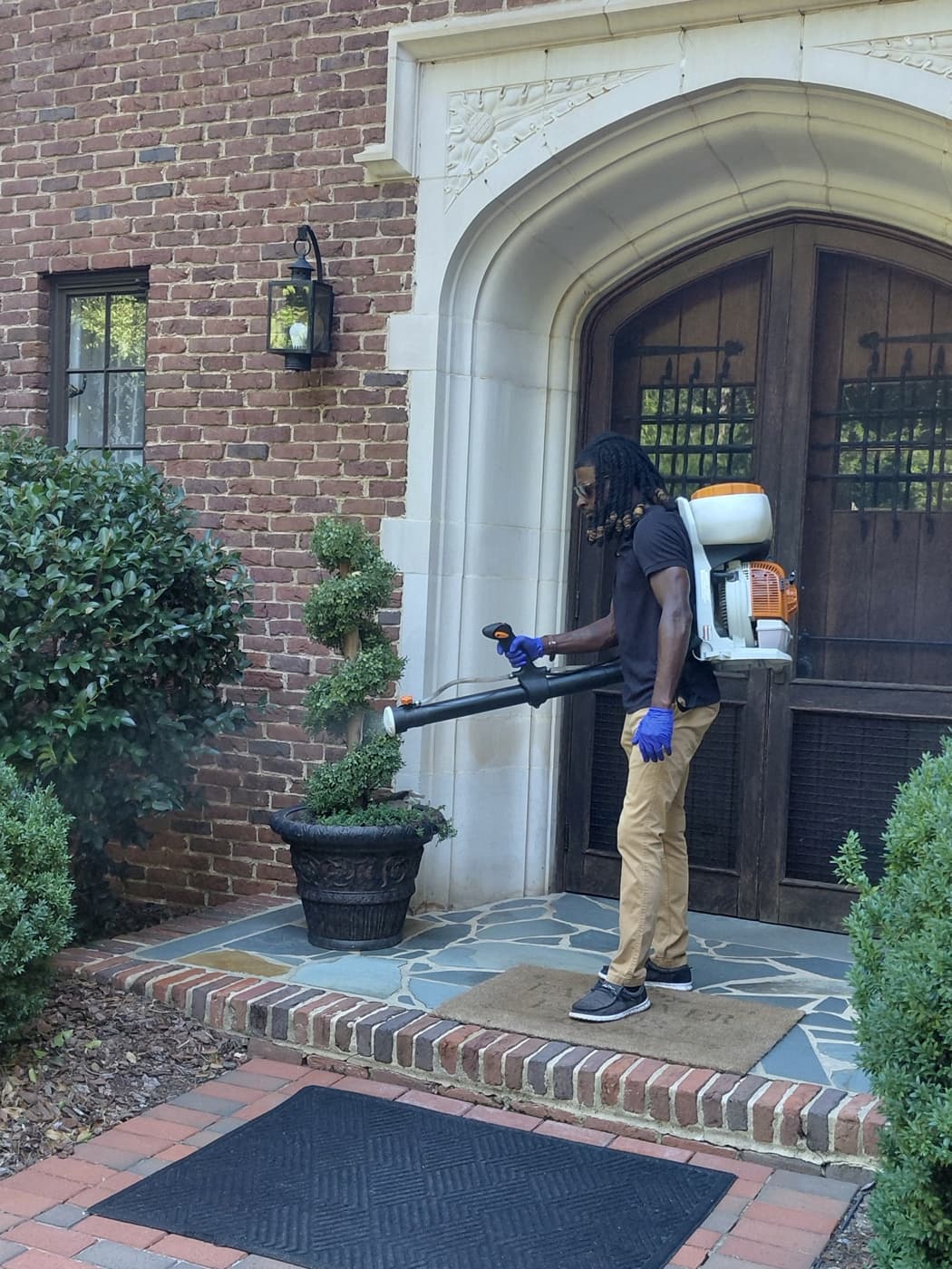 Salisbury Premium Property Defense treating entry planters and shrub beds at a Salisbury property
